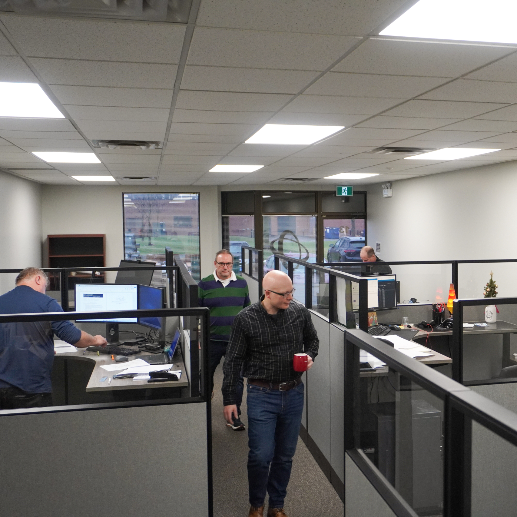 Modern office design utilizing cubicles for privacy and focus.