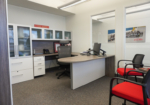 Inviting private office incorporating Canadian heritage and bold brand colours